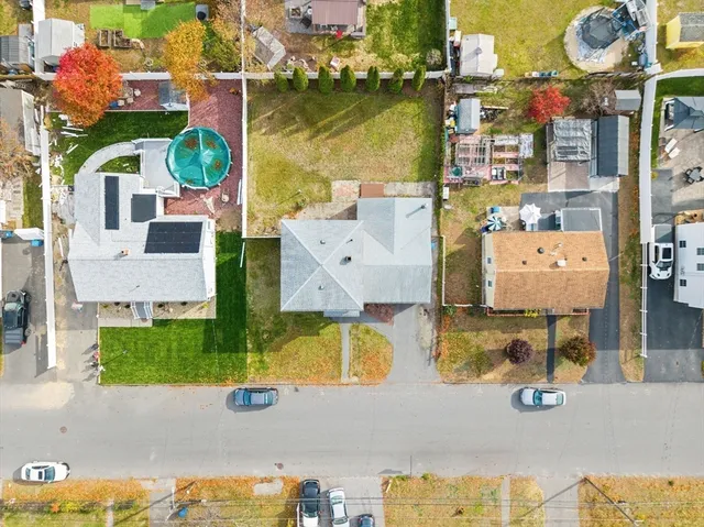 an aerial view of residential houses with outdoor space
