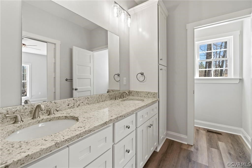 2148 Sandy Hook Road Goochland, VA 23063 - Photo 19 of 34 a bathroom with a granite countertop sink and a mirror