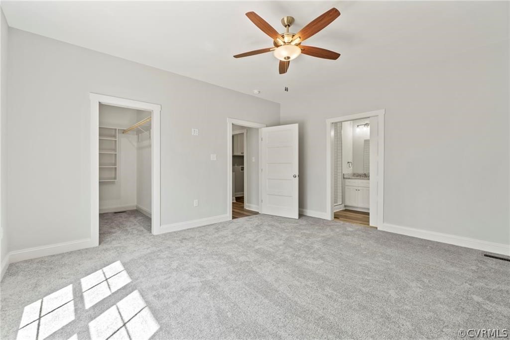2148 Sandy Hook Road Goochland, VA 23063 - Photo 29 of 34 an empty room with closet and ceiling fan
