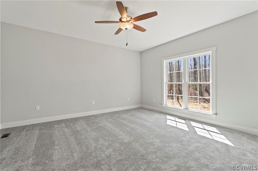 2148 Sandy Hook Road Goochland, VA 23063 - Photo 31 of 34 an empty room with a window and a ceiling fan