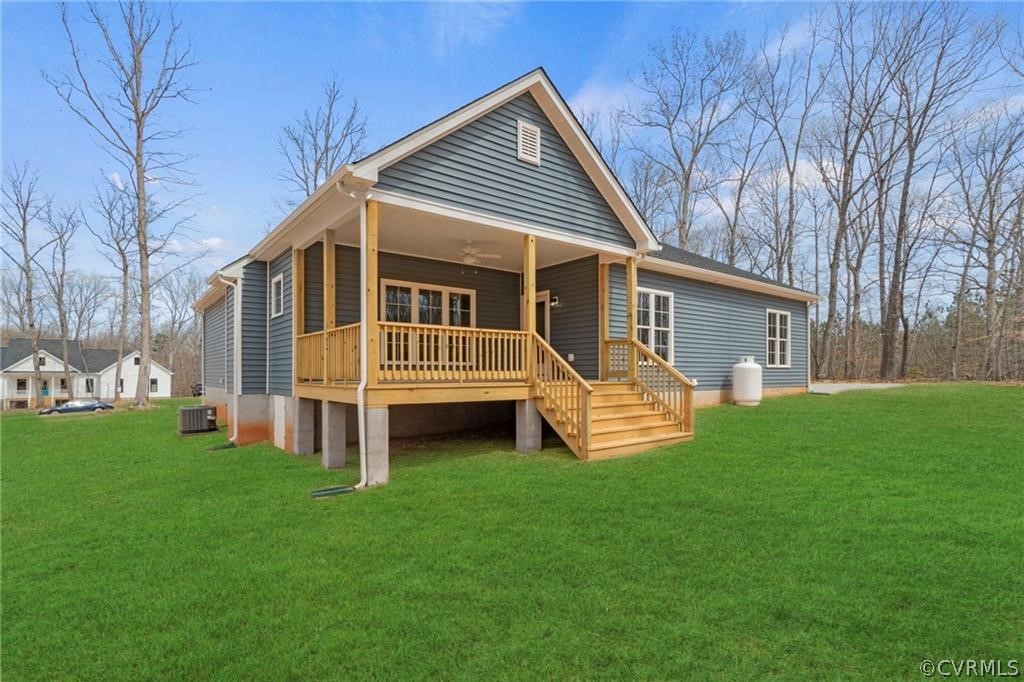 2148 Sandy Hook Road Goochland, VA 23063 - Photo 34 of 34 a front view of a house with a garden and deck