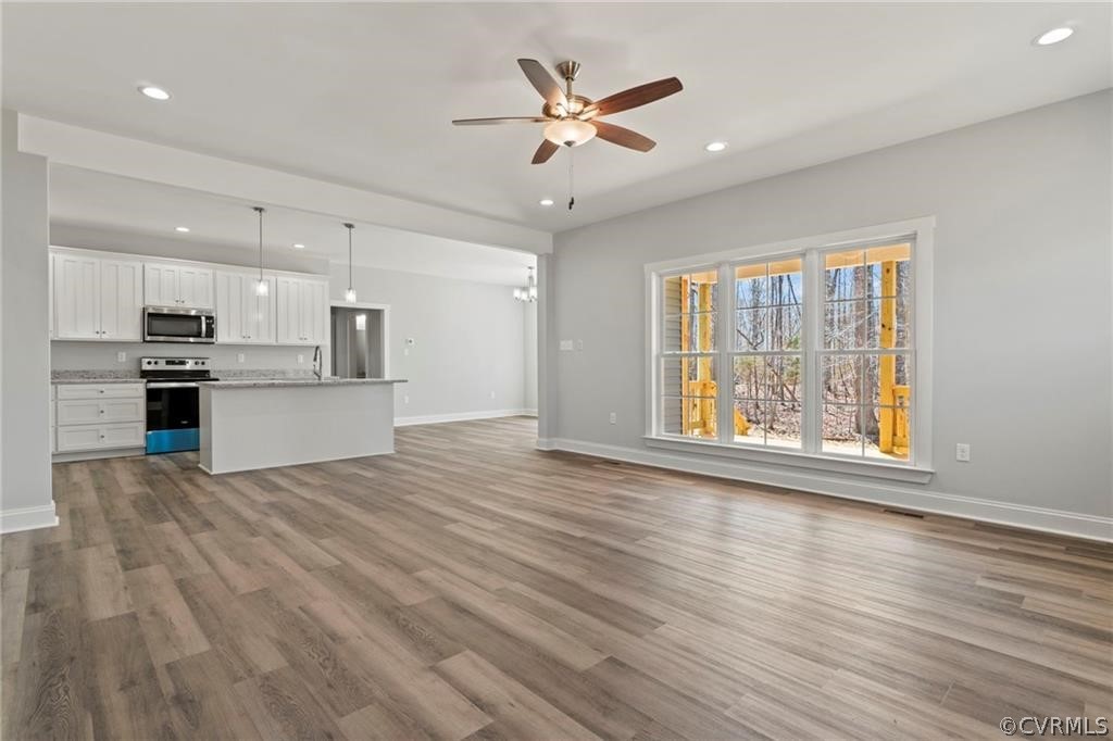 2148 Sandy Hook Road Goochland, VA 23063 - Photo 9 of 34 a view of an empty room with a window and kitchen view