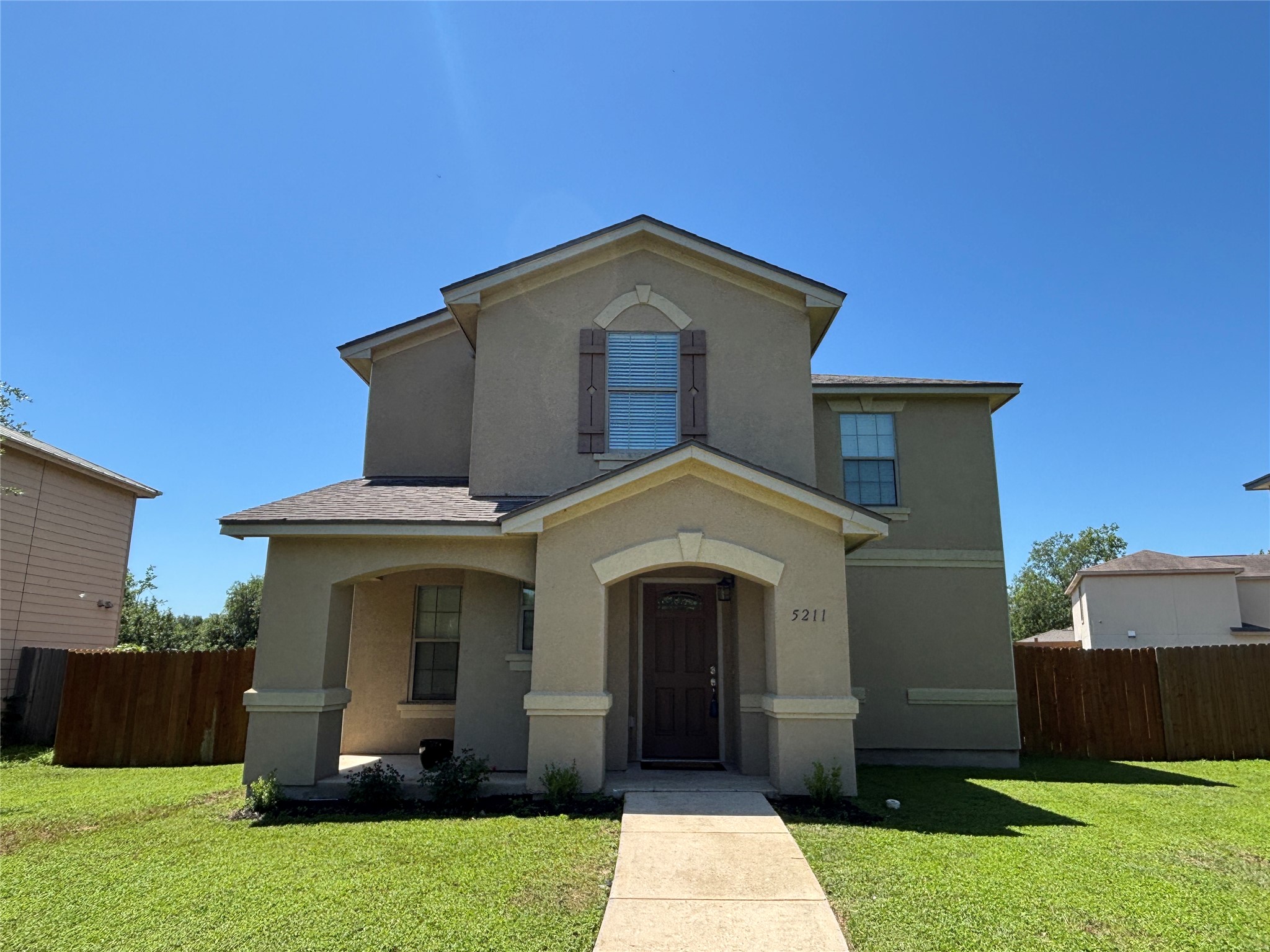 5211 Viewpoint Drive Austin, TX 78744 - Photo 20 of 25 a front view of a house with garden