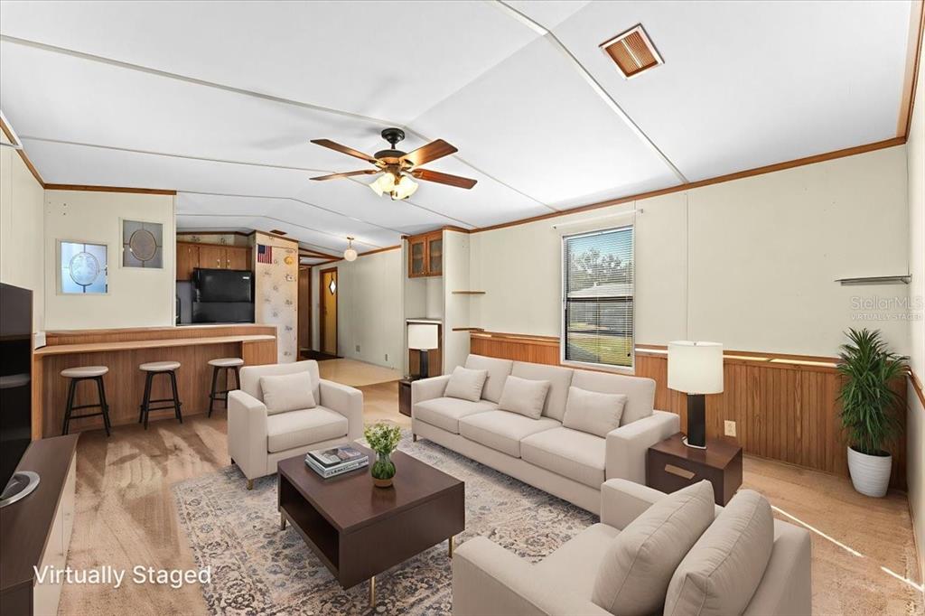 12001 Rhodine Road Riverview, FL 33579 - Photo 11 of 61 a living room with furniture and wooden floor