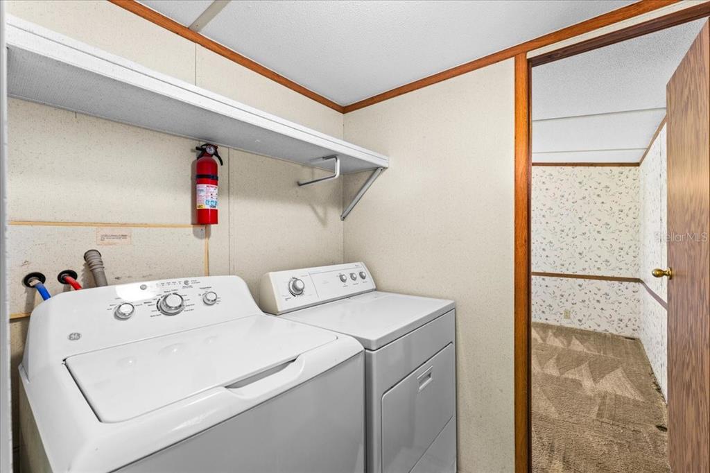 12001 Rhodine Road Riverview, FL 33579 - Photo 20 of 61 a utility room with dryer and washer