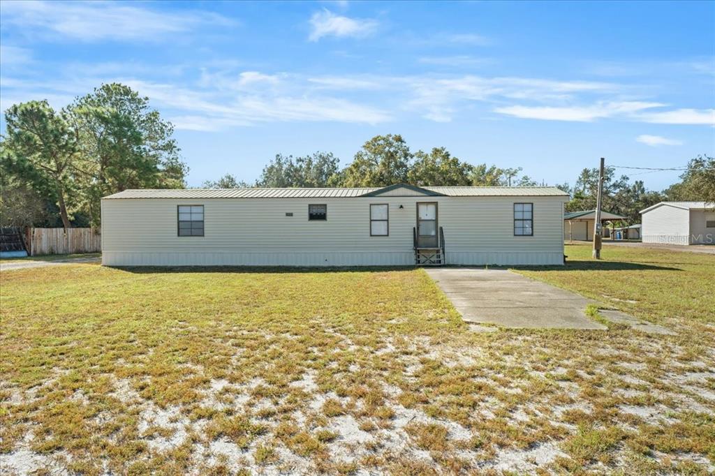 12001 Rhodine Road Riverview, FL 33579 - Photo 2 of 61 a front view of a house with a yard