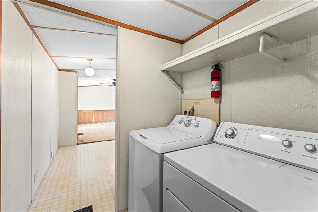 12001 Rhodine Road Riverview, FL 33579 - Photo 30 of 61 a utility room with dryer and washer