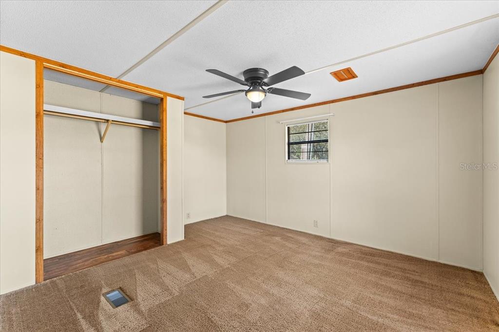 12001 Rhodine Road Riverview, FL 33579 - Photo 34 of 61 a view of a ceiling fan in a empty room