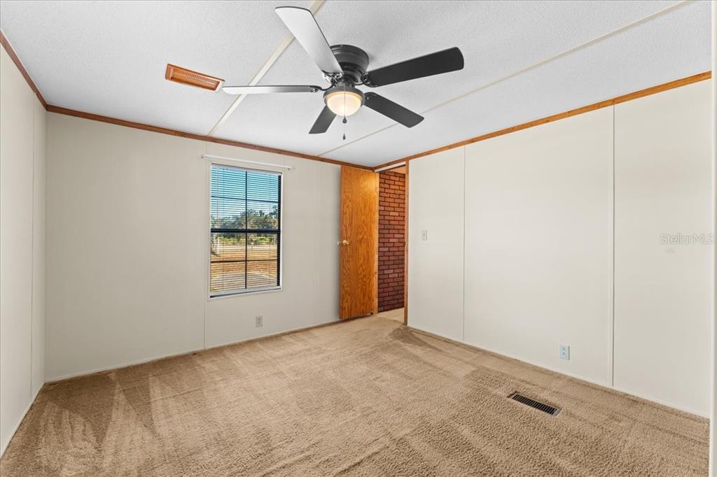 12001 Rhodine Road Riverview, FL 33579 - Photo 35 of 61 a view of an empty room with a window