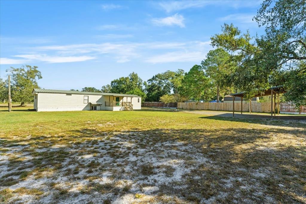 12001 Rhodine Road Riverview, FL 33579 - Photo 37 of 61 a view of swimming pool with an outdoor space and seating area