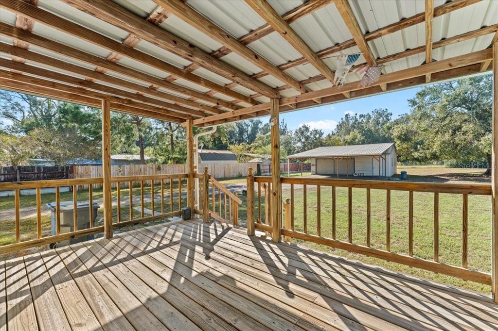 12001 Rhodine Road Riverview, FL 33579 - Photo 4 of 61 a view of a balcony with wooden floor