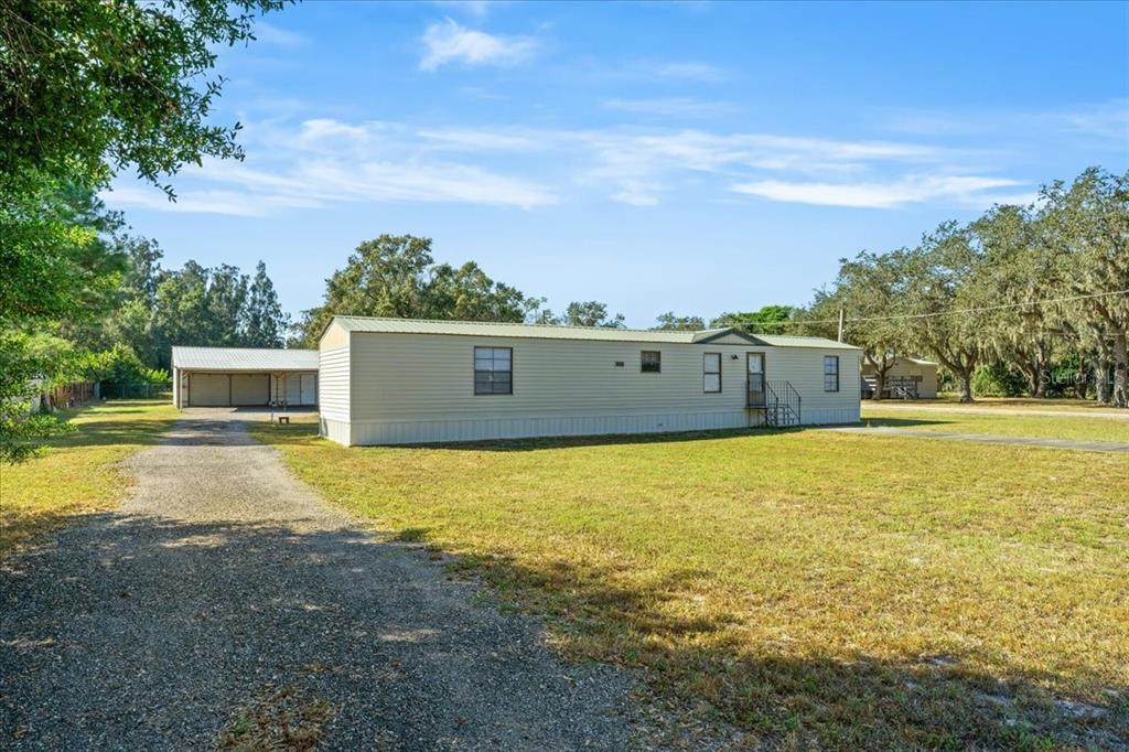 12001 Rhodine Road Riverview, FL 33579 - Photo 7 of 61 a view of an outdoor space and a yard