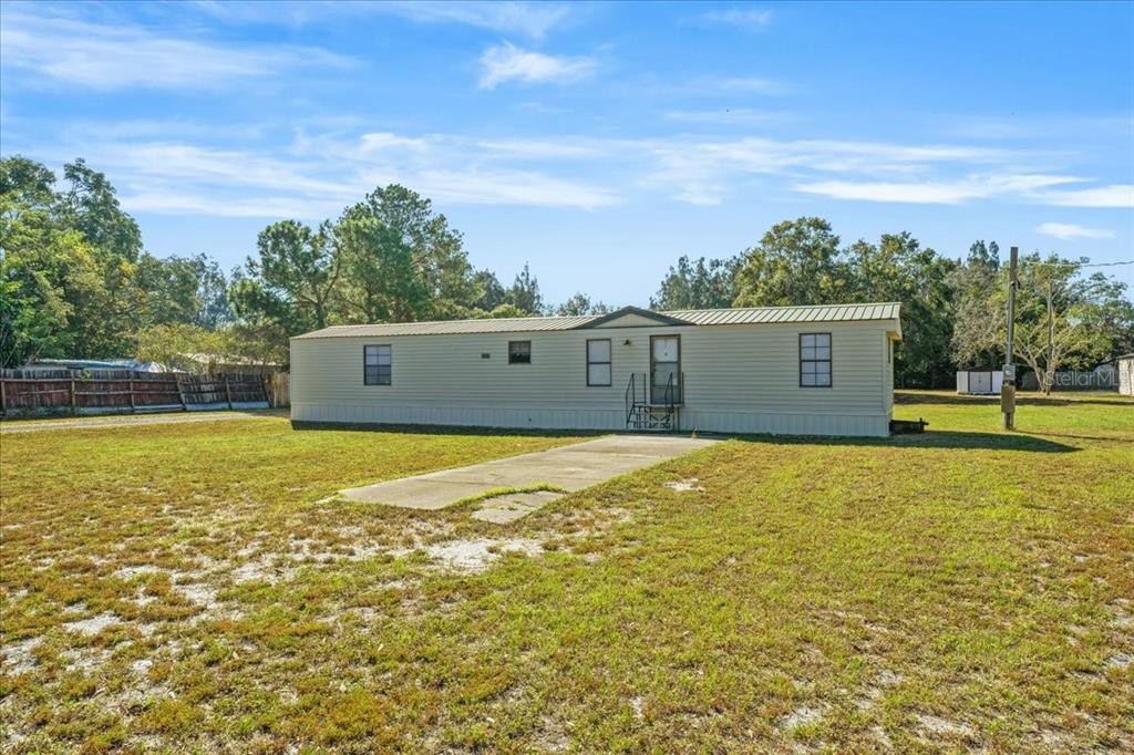 12001 Rhodine Road Riverview, FL 33579 - Photo 8 of 61 a view of a pool with a yard