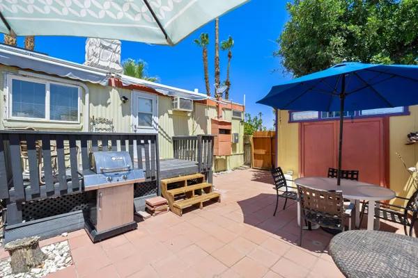 a bathroom with a granite countertop sink and a bathtub