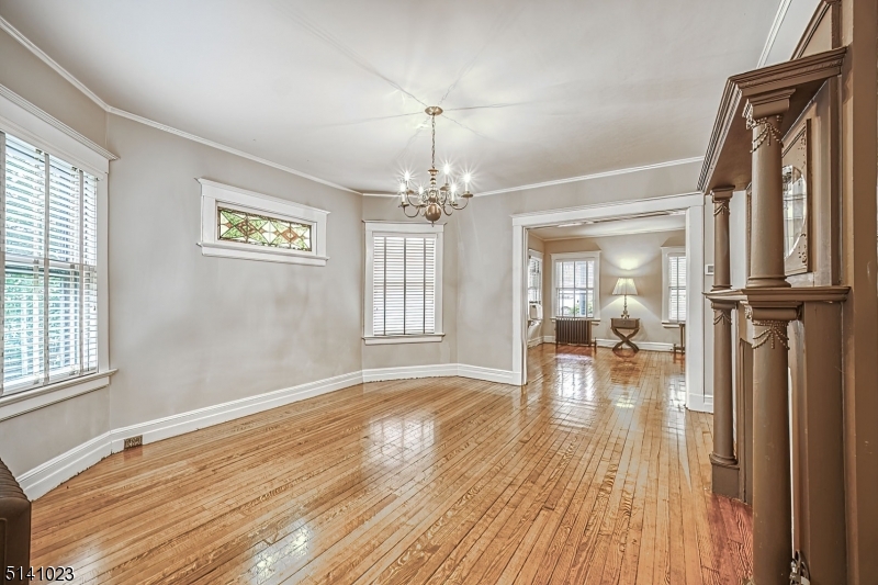 42 Gates Avenue Montclair, NJ 07042 - Photo 14 of 44 wooden floor in an empty room with a window