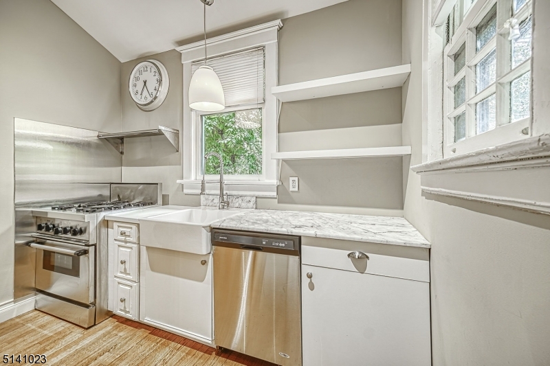 42 Gates Avenue Montclair, NJ 07042 - Photo 15 of 44 a kitchen with granite countertop a sink and a stove