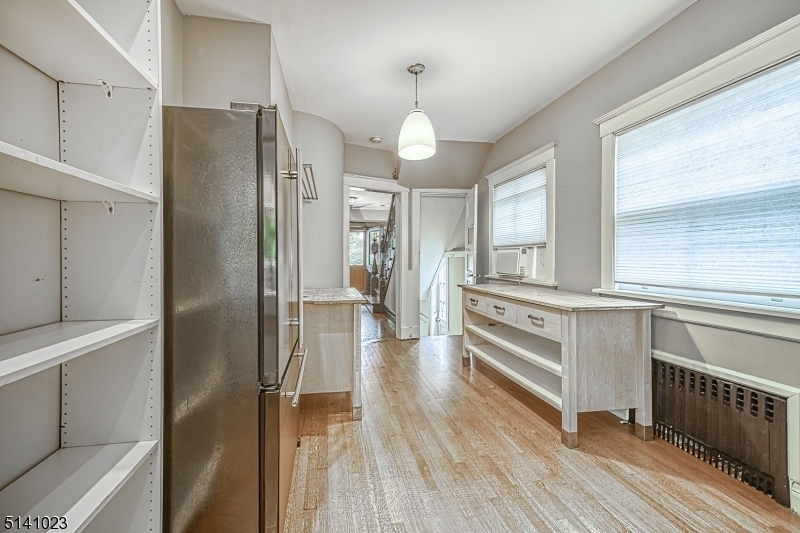 42 Gates Avenue Montclair, NJ 07042 - Photo 17 of 44 a kitchen with stainless steel appliances a refrigerator sink and cabinets