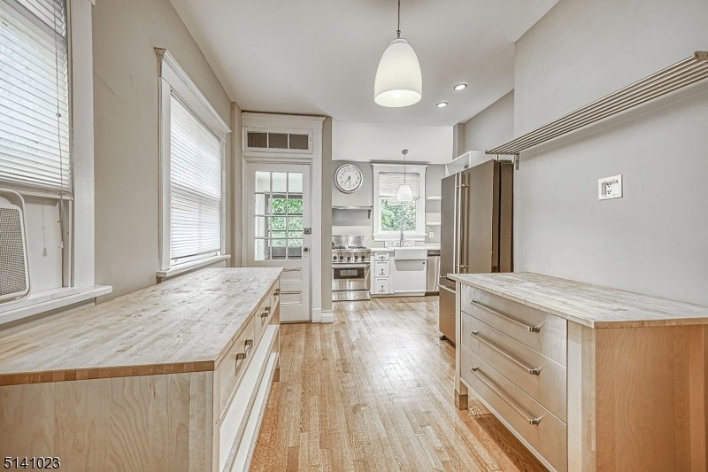 42 Gates Avenue Montclair, NJ 07042 - Photo 18 of 44 a spacious bathroom with a granite countertop sink mirror and a shower