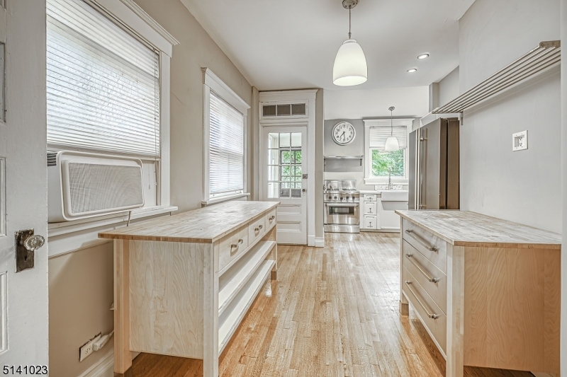 42 Gates Avenue Montclair, NJ 07042 - Photo 21 of 44 a view of a kitchen with a sink and wooden floor