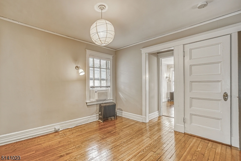 42 Gates Avenue Montclair, NJ 07042 - Photo 26 of 44 wooden floor in an empty room with a window