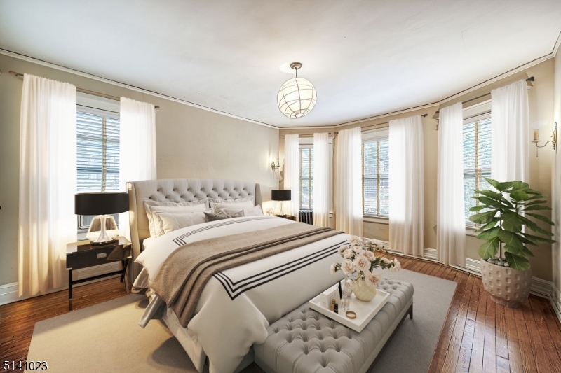 42 Gates Avenue Montclair, NJ 07042 - Photo 27 of 44 a bedroom with a bed and a window