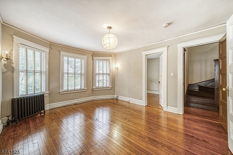 42 Gates Avenue Montclair, NJ 07042 - Photo 28 of 44 an empty room with wooden floor and windows