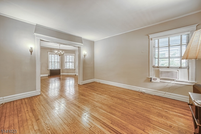 42 Gates Avenue Montclair, NJ 07042 - Photo 5 of 44 wooden floor in an empty room with a window