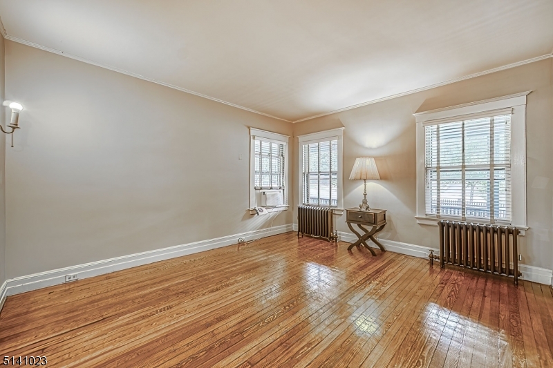 42 Gates Avenue Montclair, NJ 07042 - Photo 6 of 44 a view of a room with wooden floor and a window