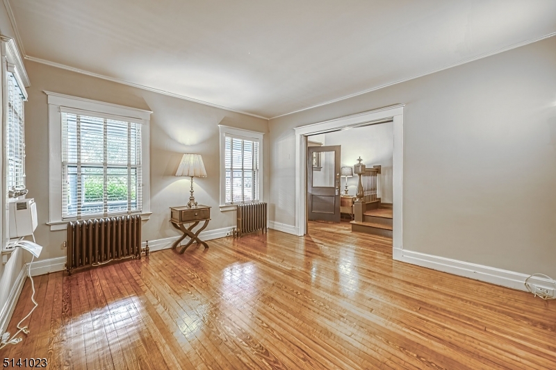 42 Gates Avenue Montclair, NJ 07042 - Photo 7 of 44 a living room with furniture and a wooden floor