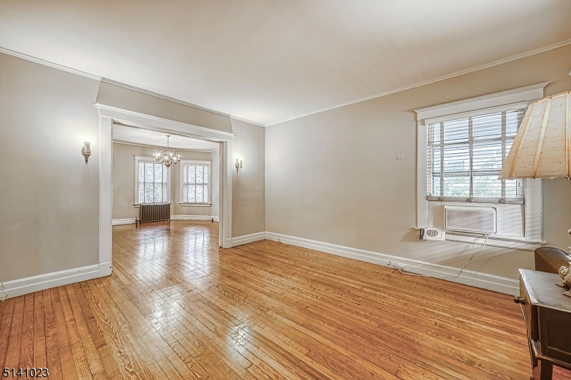 42 Gates Avenue Montclair, NJ 07042 - Photo 9 of 44 wooden floor in an empty room with a window
