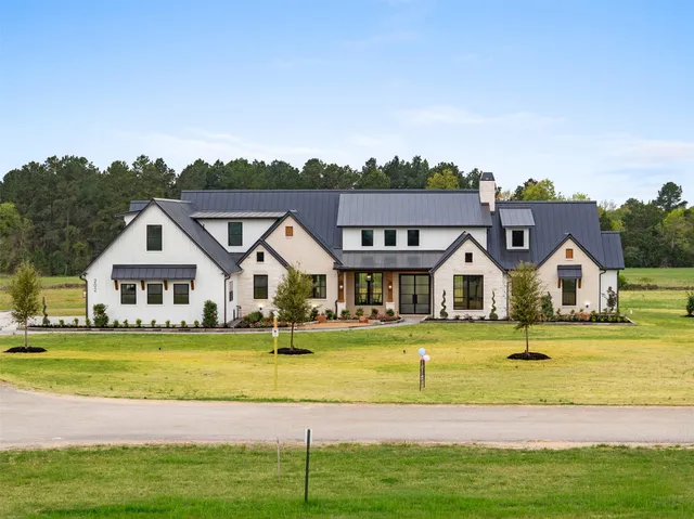 a house with swimming pool in front of it