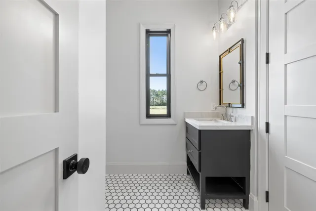 a room with a sink and a mirror