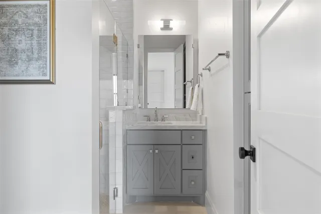 an empty room with a window and wooden floor