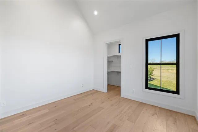 a bathroom with a granite countertop sink mirror and shower
