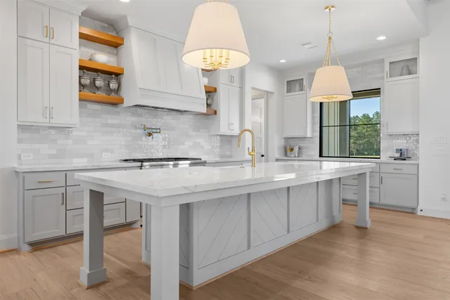 a kitchen with a sink cabinets and window