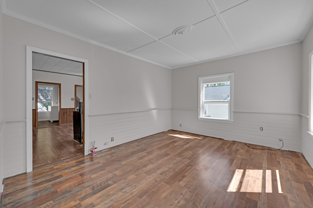 47 Morris Street Southbridge, MA 01550 - Photo 10 of 40 an empty room with wooden floor and windows