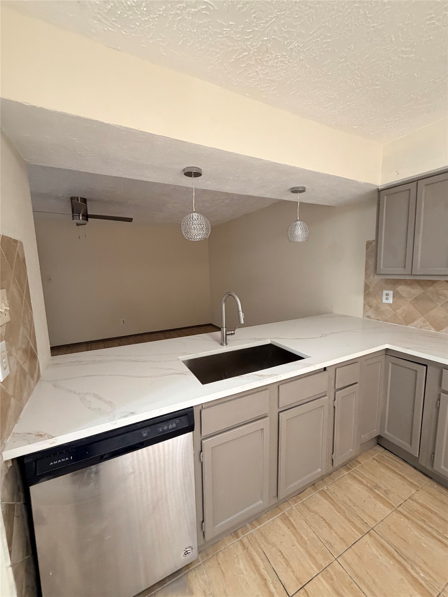 9327 Westacre Place Houston, TX 77083 - Photo 3 of 7 a kitchen with a sink and cabinets