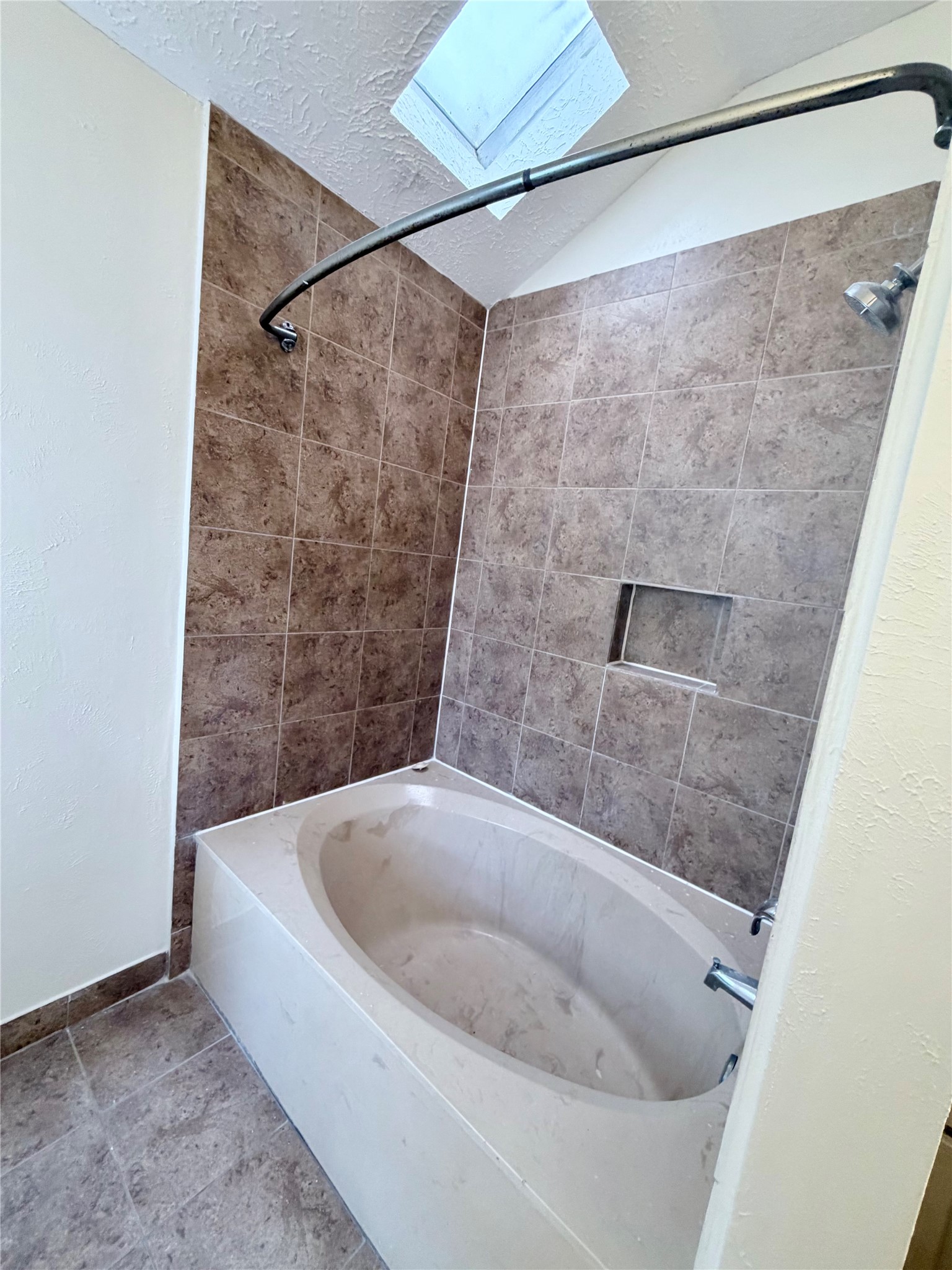 9327 Westacre Place Houston, TX 77083 - Photo 4 of 7 a bathroom with a bathtub
