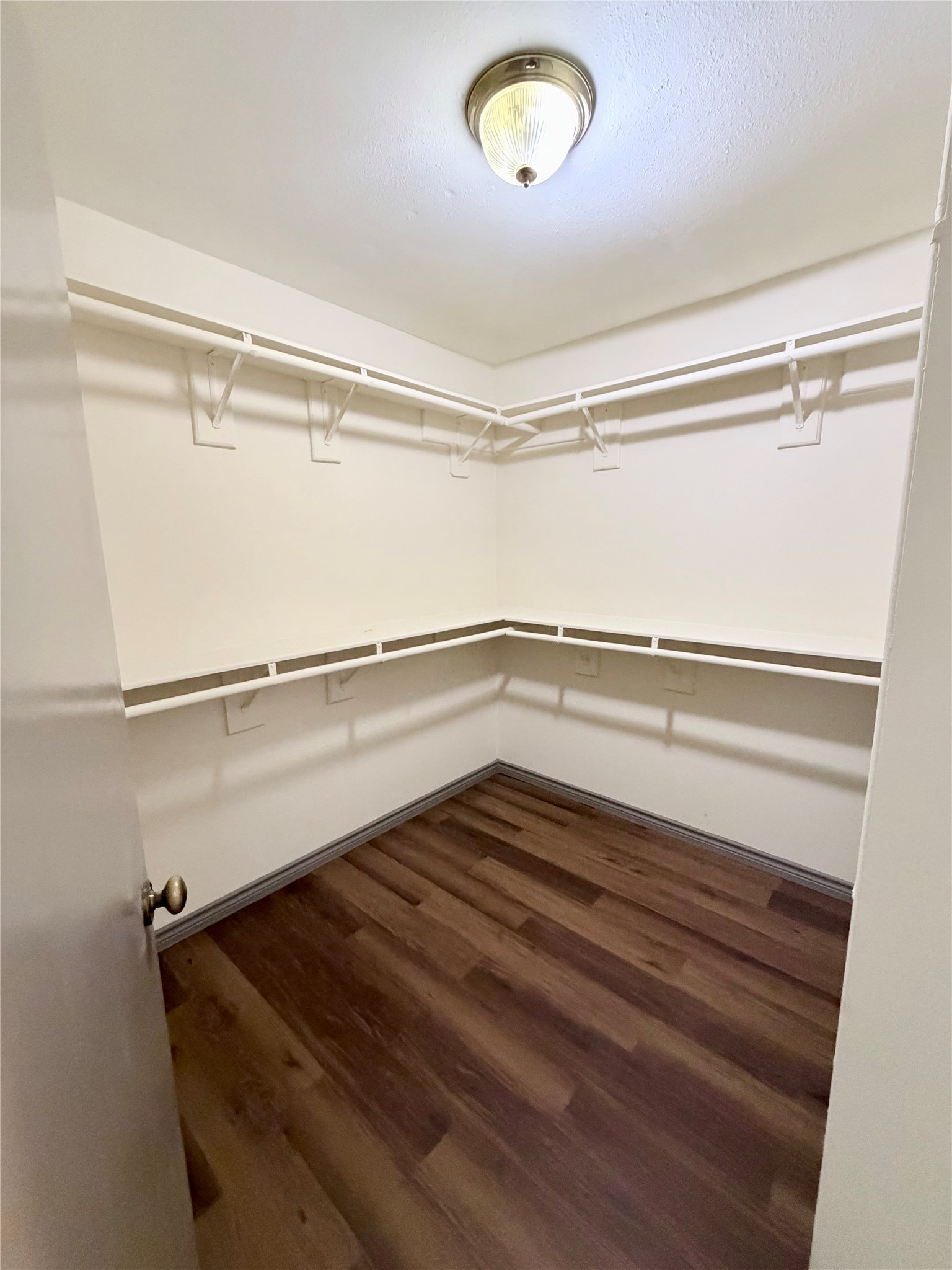 9327 Westacre Place Houston, TX 77083 - Photo 5 of 7 a view of a room with wooden floor