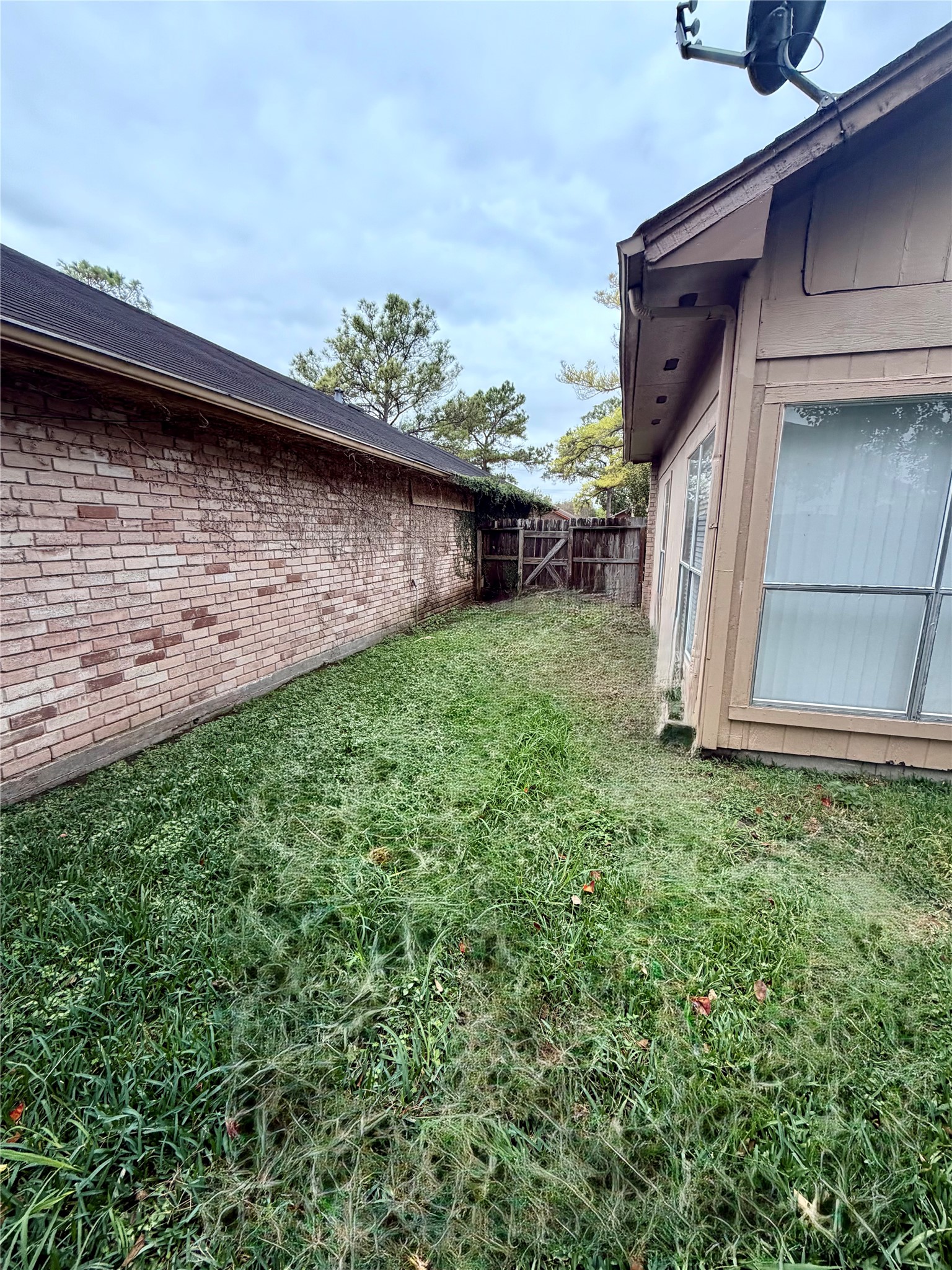 9327 Westacre Place Houston, TX 77083 - Photo 7 of 7 a view of a backyard