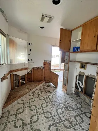 a bedroom with furniture and a rug