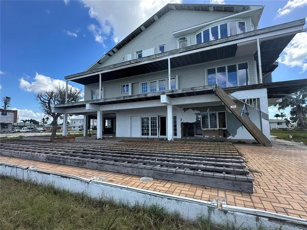 a front view of a house with a small yard