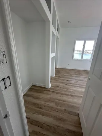 a view of wooden floor in an empty room