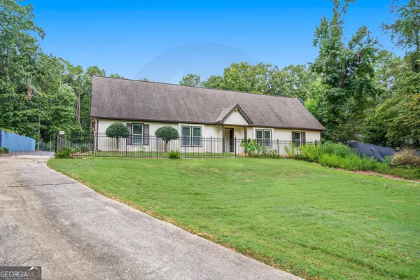a front view of a house with a yard