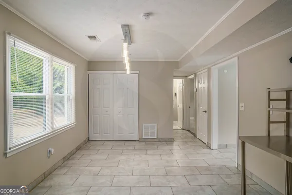a view of an empty room with a window
