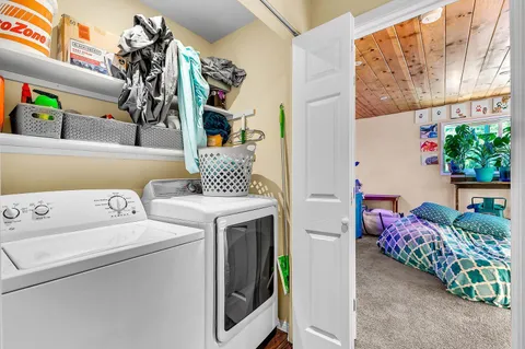 a bedroom with a bed and a fireplace