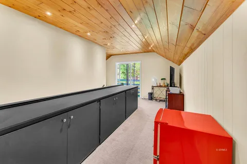 a view of an empty room with a fireplace