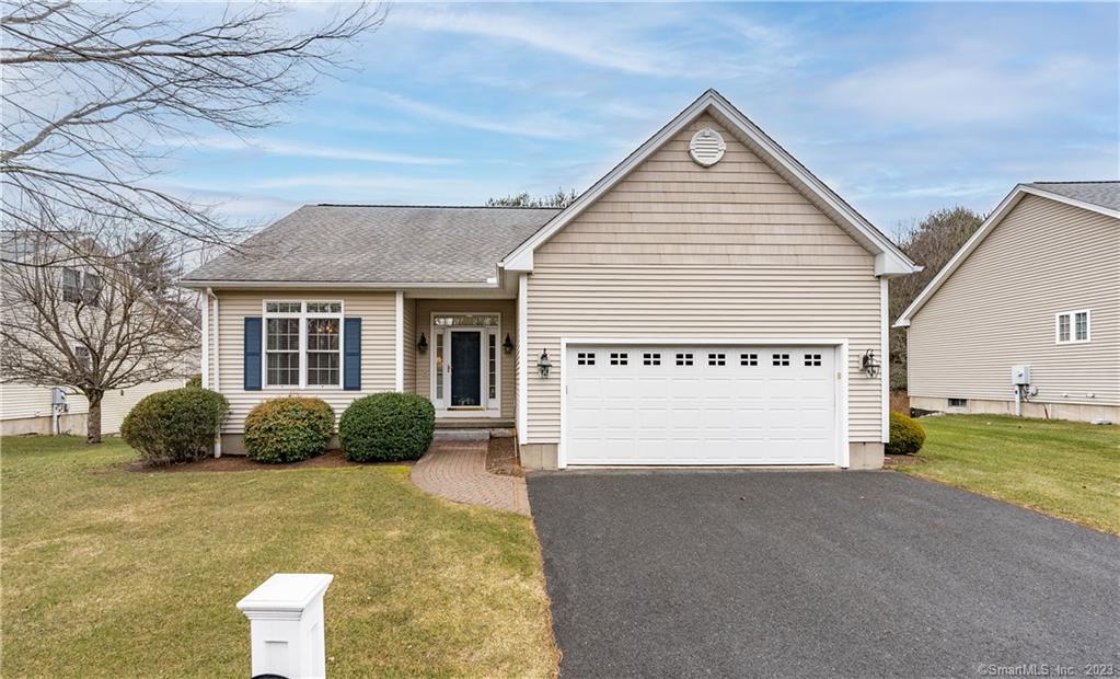 23 Quail Hollow, Unit 23 Enfield, CT 06082 - Photo 1 of 1 a view of a house with a yard