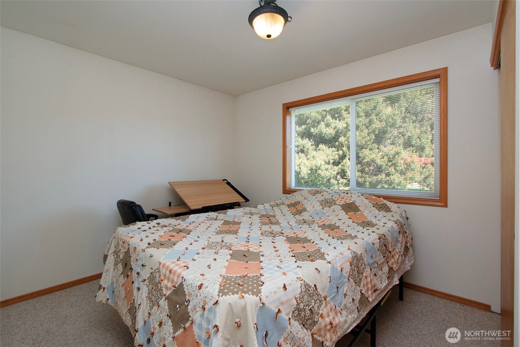 101 Timothy Lane Sequim, WA 98382 - Photo 19 of 39 a bedroom with a bed and a window