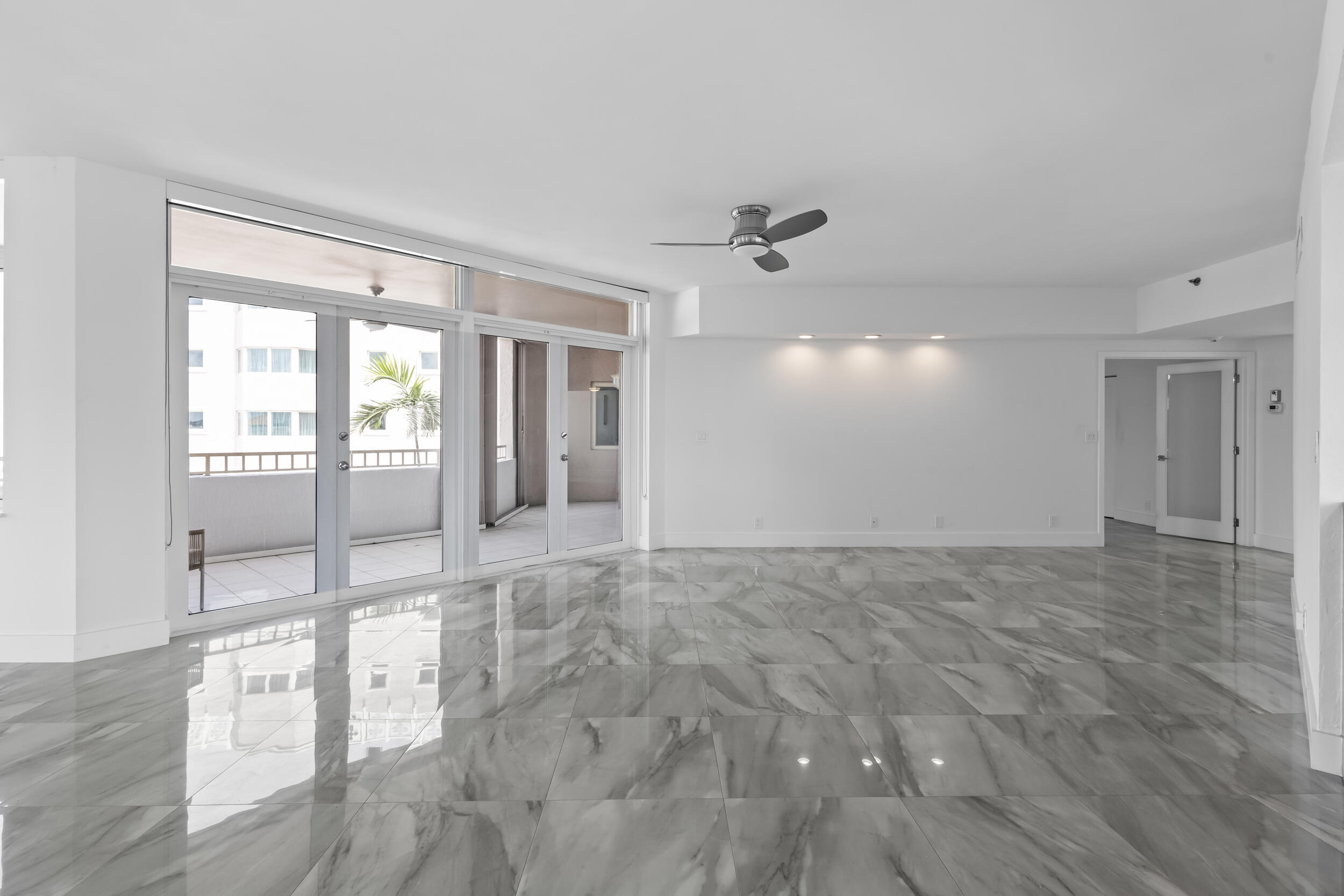 300 Southeast 5th Avenue, Unit 5180 Boca Raton, FL 33432 - Photo 16 of 45 a view of empty room with wooden floor and fan